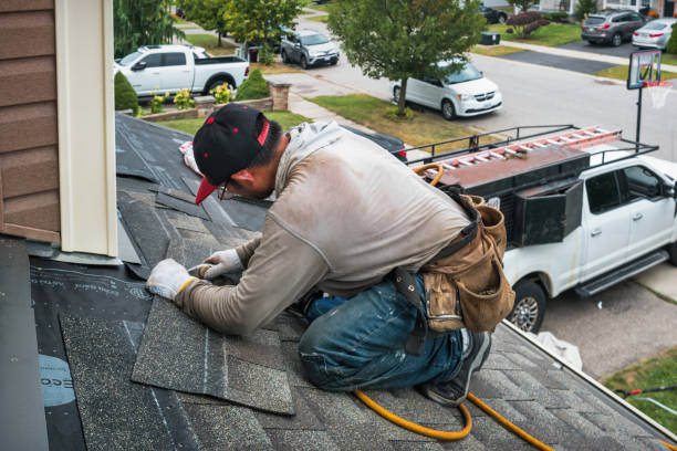 Professional Roofing technician working in Guilderland Center, NY
